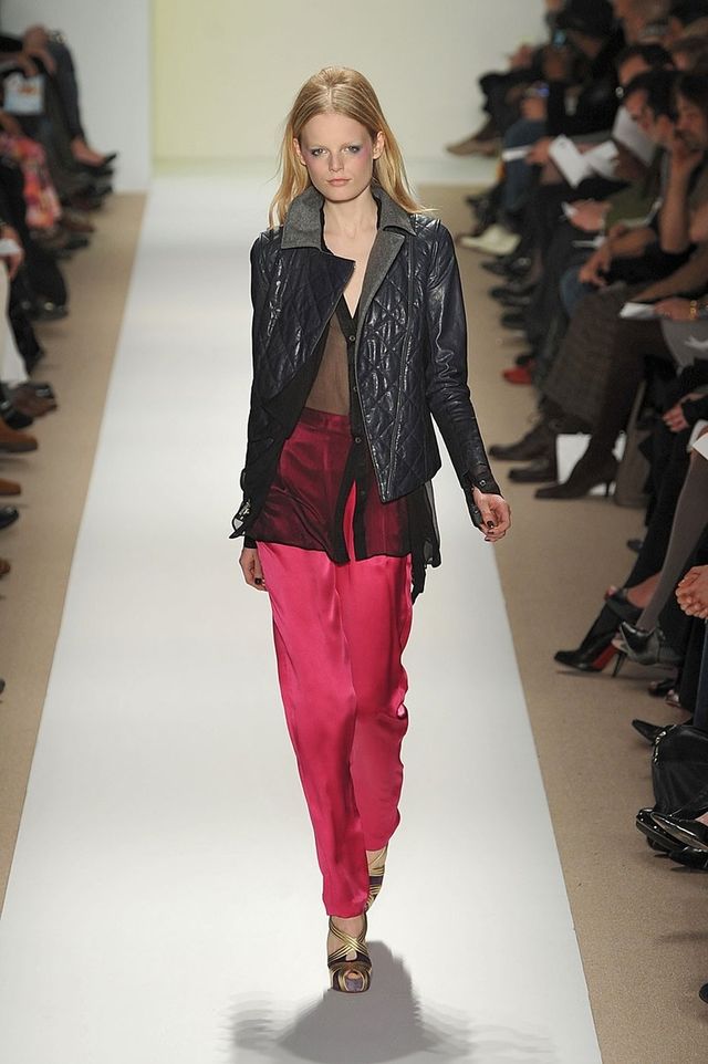 Footwear, Shoulder, Fashion show, Joint, Runway, Outerwear, Red, Style, Fashion model, Jacket, 