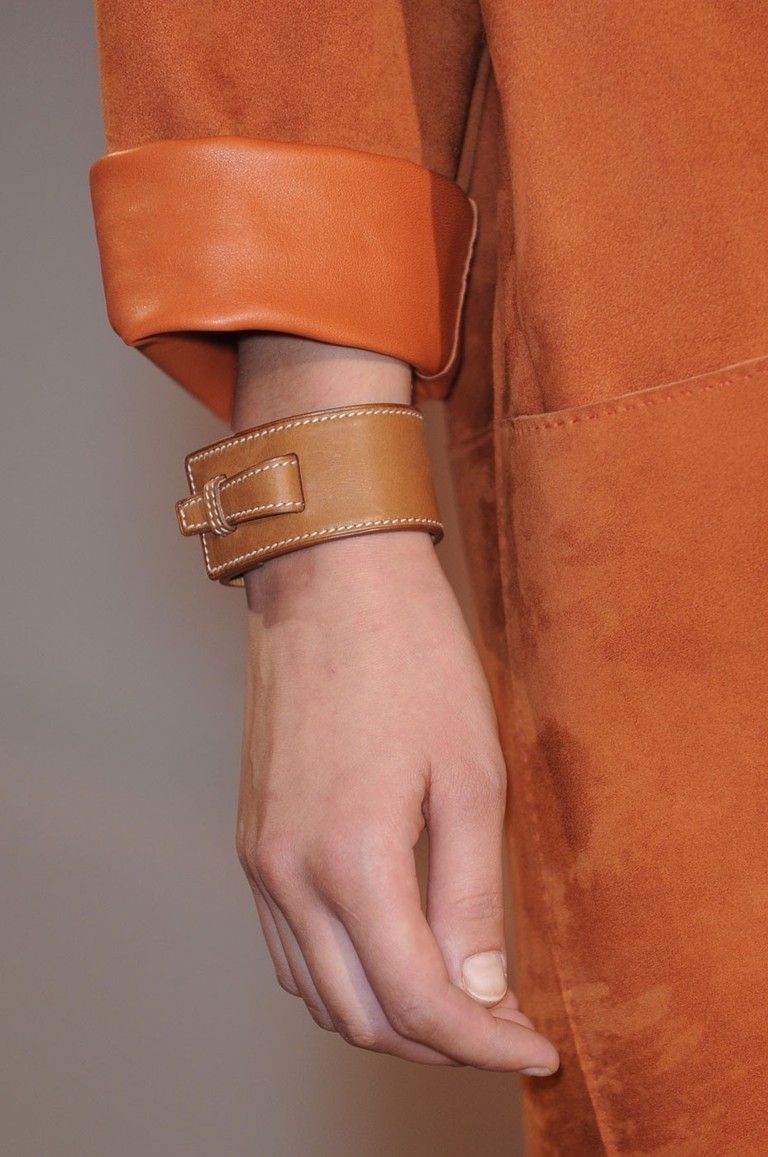 Finger, Brown, Textile, Wrist, Joint, Khaki, Fashion accessory, Tan, Orange, Leather, 