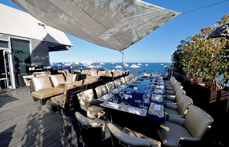 Table, Outdoor furniture, Azure, Resort, Ocean, Couch, Shade, Restaurant, Seaside resort, Resort town, 