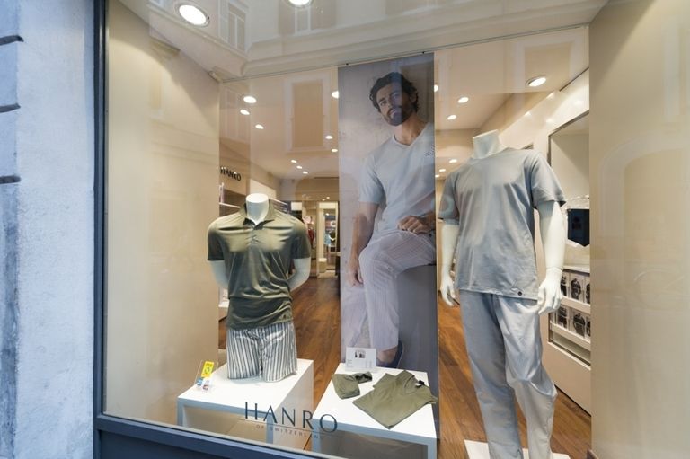 Mannequin, Ceiling, Display window, Display case, Retail, Fixture, Boutique, Fashion design, Transparent material, Collection, 