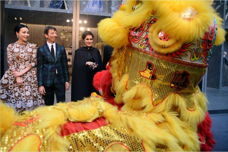 Yellow, Event, Suit, Tradition, Dress, Fur, Costume, Chinese new year, Natural material, Mascot, 