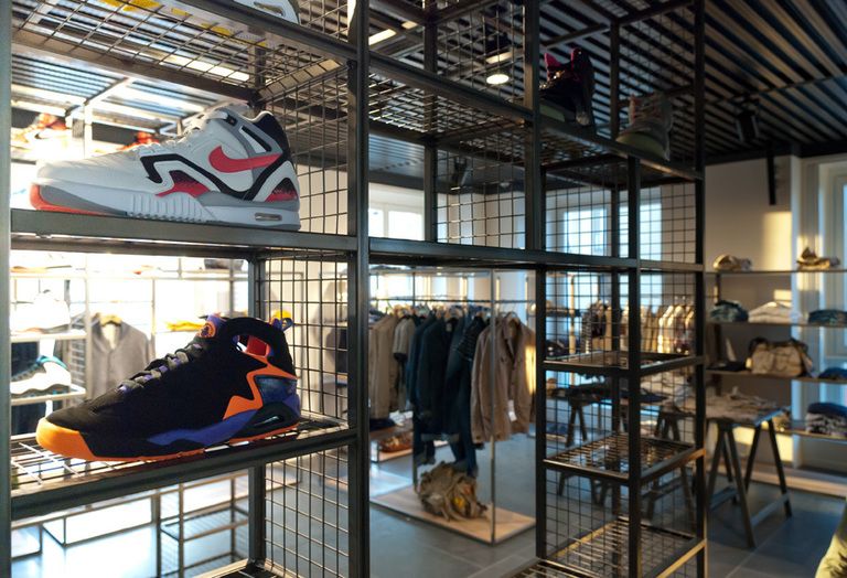 Retail, Carmine, Athletic shoe, Shelf, Outlet store, Iron, Shelving, Collection, Display case, Clothes hanger, 