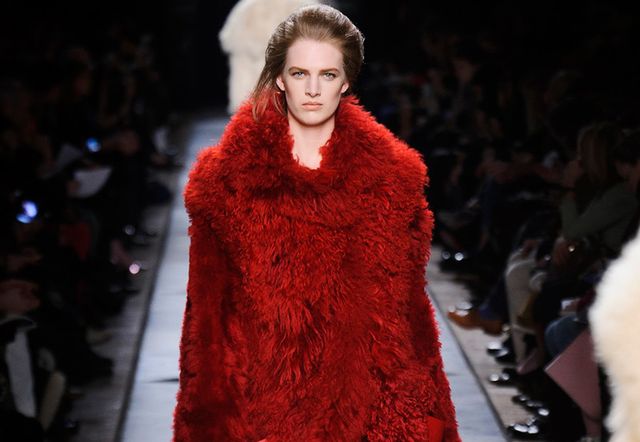Lip, Fashion show, Winter, Textile, Red, Fur clothing, Fashion model, Style, Runway, Natural material, 