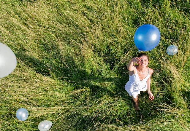 Grass, Balloon, Dress, People in nature, Ball, Party supply, Grass family, Ball, Sphere, Meadow, 