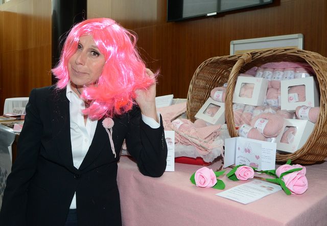 Outerwear, Pink, Coat, Suit, Wig, Tablecloth, Linens, Interior design, Picture frame, Home accessories, 