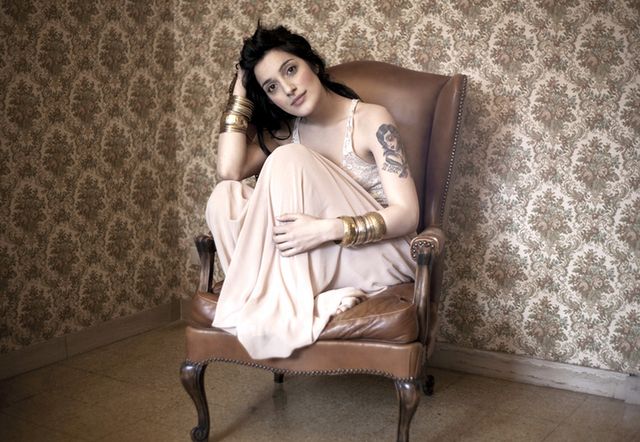 Human, Brown, Comfort, Sitting, Jewellery, Black hair, Beauty, Flash photography, Fashion model, Couch, 
