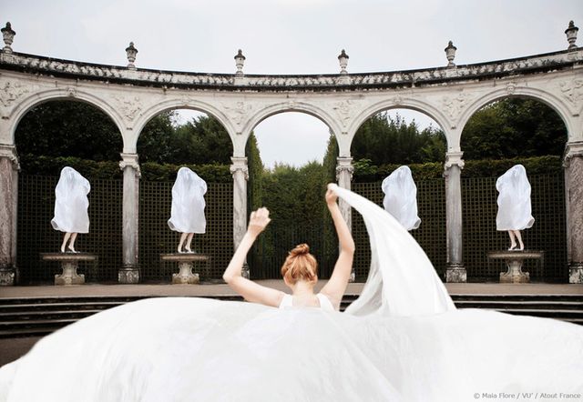 Bridal clothing, Dress, Gown, Wedding dress, Bridal veil, Formal wear, Veil, Arch, Bride, Bridal party dress, 