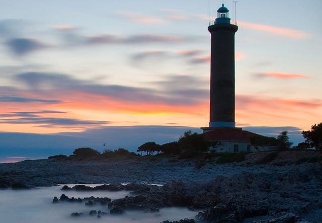 Body of water, Sky, Tower, Cloud, Dusk, Natural landscape, Beacon, Sunset, Evening, Horizon, 