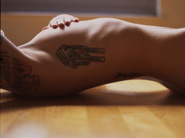Skin, Tattoo, Human leg, Joint, Wrist, Organ, Muscle, Temporary tattoo, Tan, Symbol, 