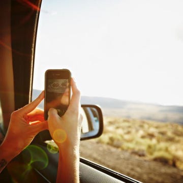 Finger, Glass, Sunlight, Travel, Automotive mirror, Mobile phone, Nail, Road trip, Communication Device, Portable communications device, 