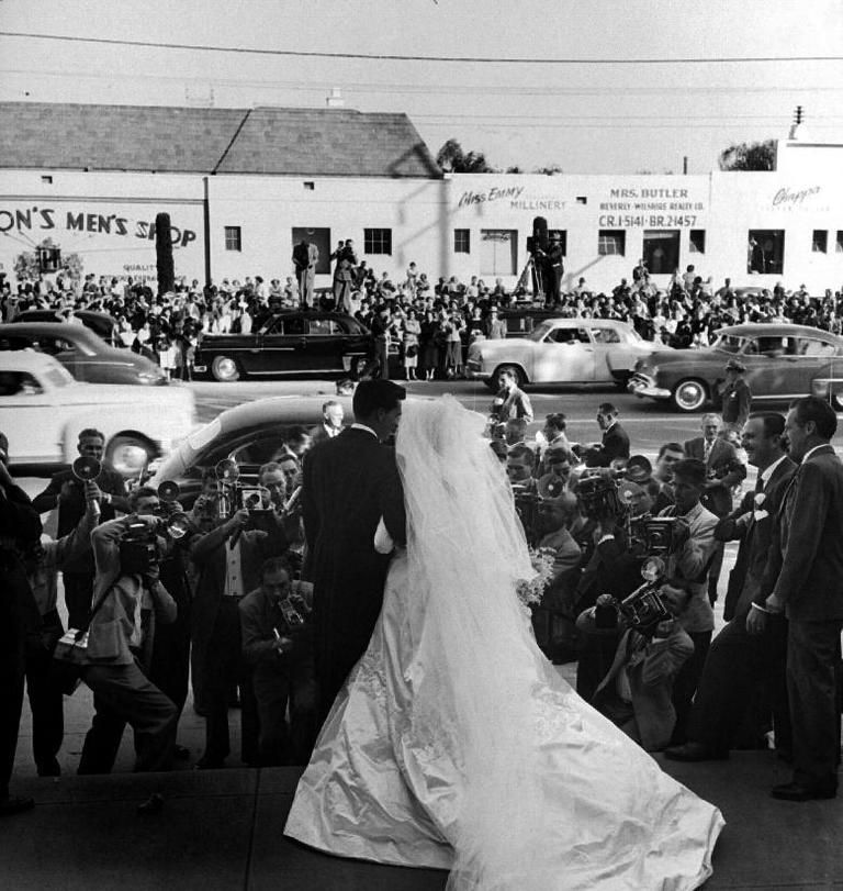 People, Crowd, Monochrome, Photograph, Bridal clothing, Bridal veil, Veil, Dress, Gown, Suit, 