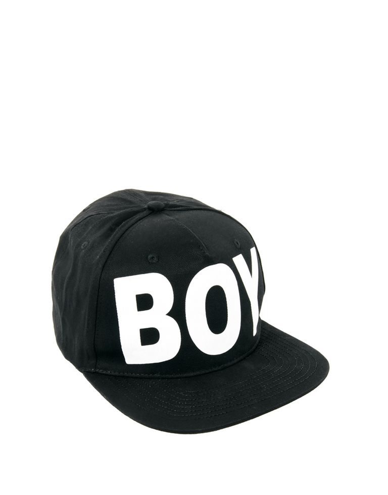 Cap, Hat, Headgear, Font, Costume accessory, Baseball cap, Cricket cap, Symbol, Costume hat, Graphics, 