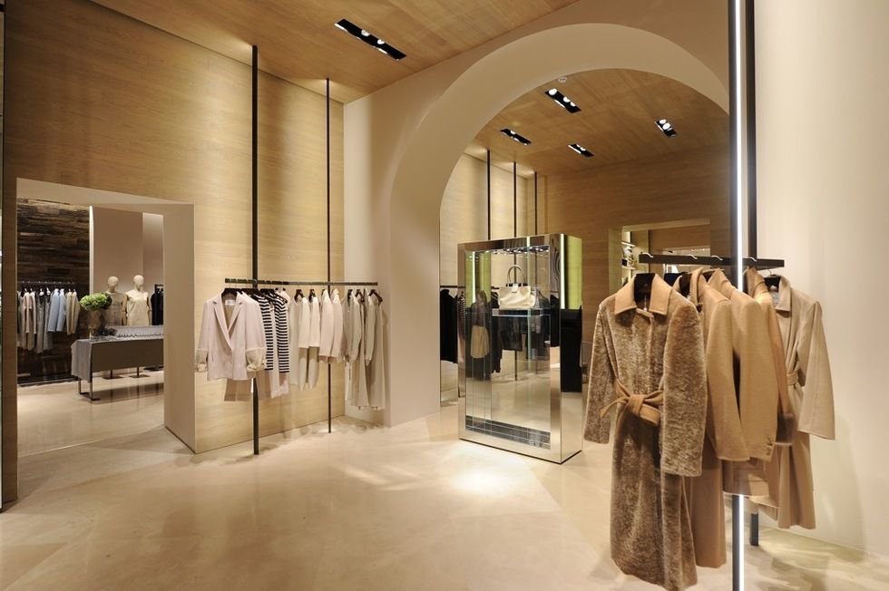 Interior design, Floor, Ceiling, Retail, Fashion, Clothes hanger, Light fixture, Beige, Boutique, Collection, 