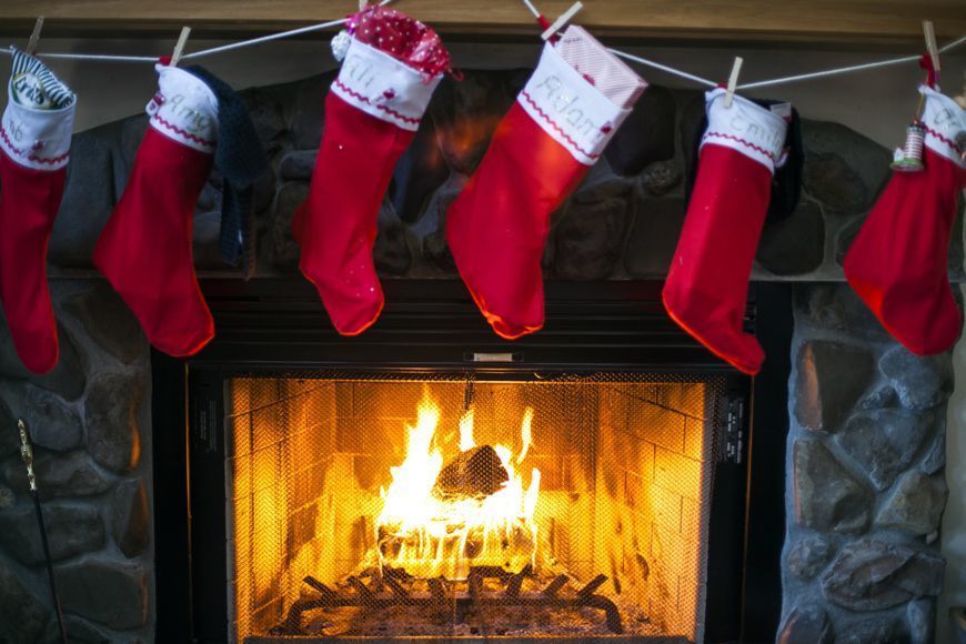 Wood, Red, Hearth, Christmas stocking, Heat, Flame, Carmine, Fire, Costume accessory, Fireplace, 