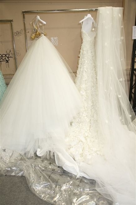 Textile, Wedding dress, Bridal accessory, Bridal clothing, Gown, Picture frame, Veil, Ivory, Embellishment, Bride, 