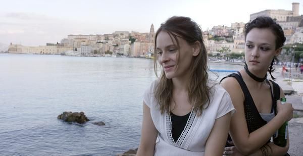 Hair, Face, Body of water, Nose, Ear, Hairstyle, Eye, Tourism, Photograph, Sleeveless shirt, 