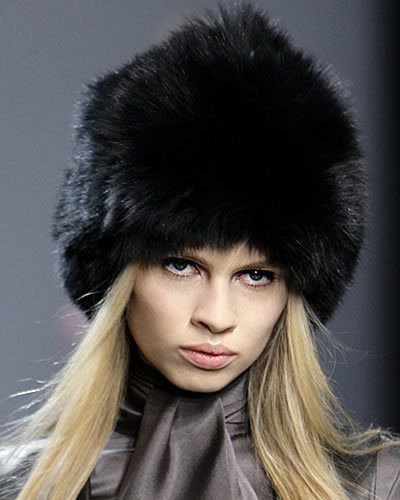 Nose, Lip, Hairstyle, Chin, Textile, Fur clothing, Headgear, Costume accessory, Fashion, Natural material, 