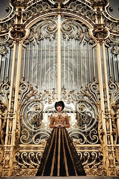Dress, Metal, Iron, Holy places, Light fixture, Religious institute, Haute couture, Gown, Bronze, 