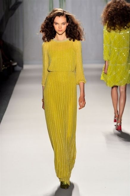 Yellow, Hairstyle, Shoulder, Joint, Waist, Style, Fashion model, One-piece garment, Fashion show, Fashion, 