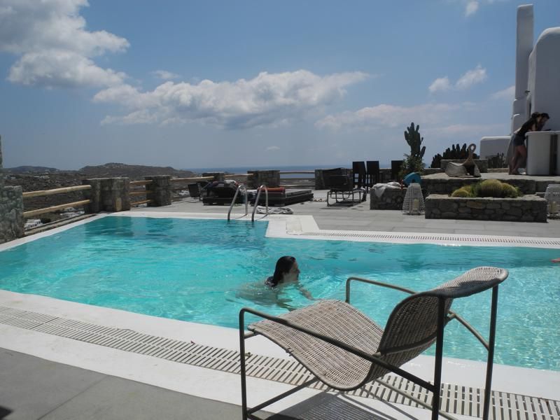 Swimming pool, Property, Water, Leisure, Aqua, Resort, Real estate, Azure, Outdoor furniture, Sunlounger, 