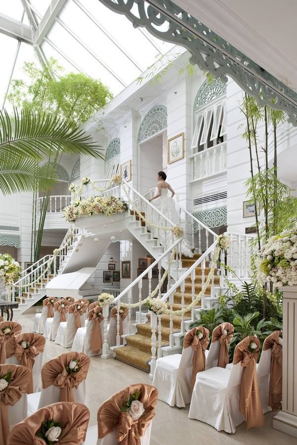 Petal, White, Dress, Bridal clothing, Stairs, Real estate, Wedding dress, Tradition, House, Bride, 