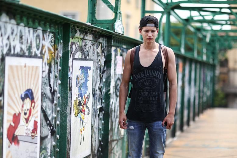 Sleeveless shirt, Denim, Textile, Jeans, Standing, Street fashion, Undershirt, Paint, Active tank, Vest, 