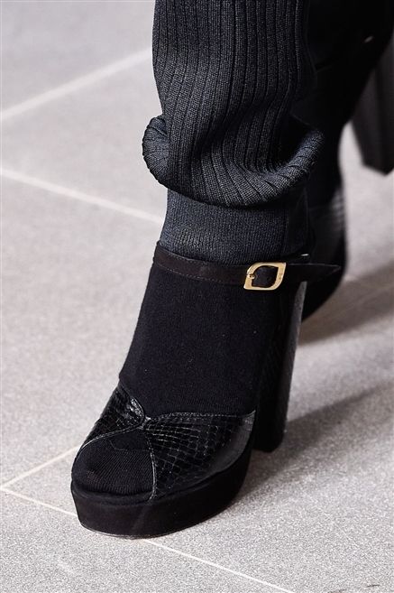 Black, Sock, Street fashion, Leather, Boot, Woolen, Shadow, Costume accessory, Wool, Synthetic rubber, 