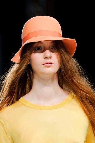 Clothing, Lip, Mouth, Brown, Hairstyle, Hat, Skin, Chin, Shoulder, Fashion accessory, 