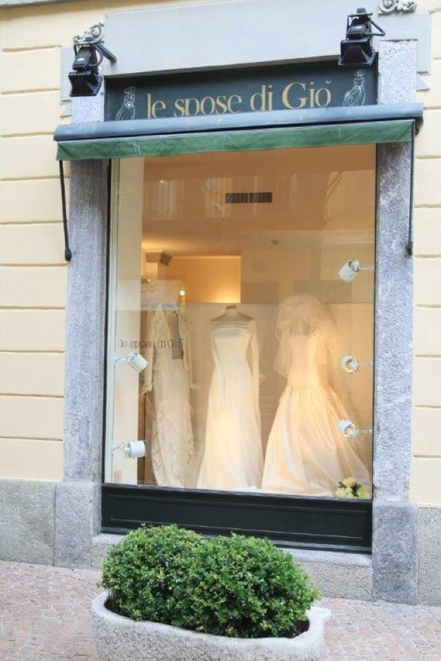 Dress, Gown, Wedding dress, Display window, Brick, One-piece garment, Molding, Bridal party dress, Brickwork, 