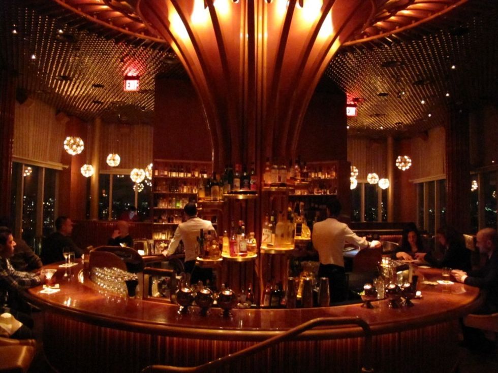 Lighting, Interior design, Barware, Hall, Restaurant, Light fixture, Function hall, Drinking establishment, Bottle, Bar, 