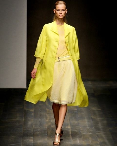 Clothing, Footwear, Yellow, Sleeve, Human body, Shoulder, Fashion show, Joint, Outerwear, Style, 