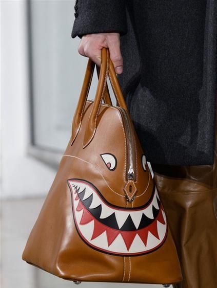 Brown, Tan, Costume accessory, Khaki, Beige, Bag, Tooth, Leather, Shoulder bag, Fictional character, 