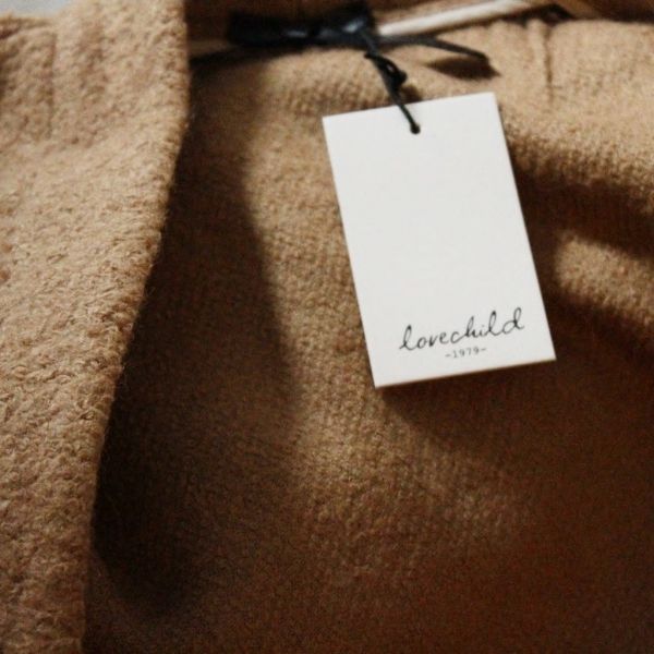Tan, Beige, Material property, Label, Button, Handwriting, 