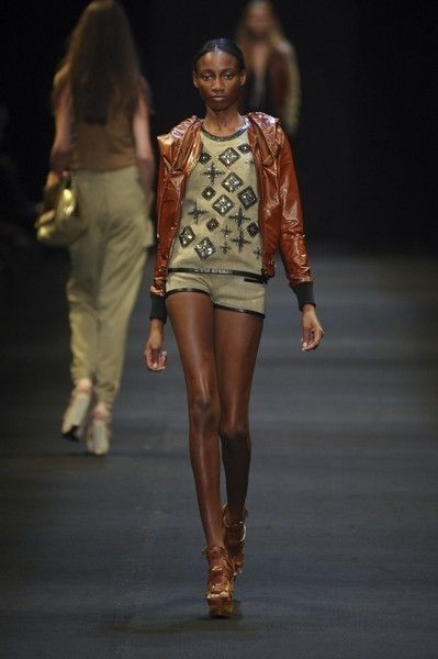 Clothing, Brown, Human body, Fashion show, Joint, Runway, Outerwear, Jewellery, Human leg, Style, 
