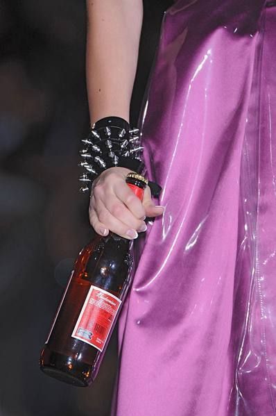 Finger, Bottle, Glass bottle, Drink, Hand, Purple, Alcohol, Fluid, Alcoholic beverage, Wrist, 
