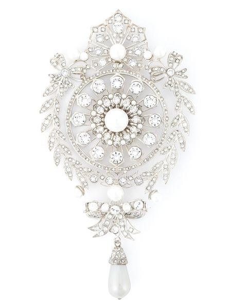 White, Interior design, Silver, Natural material, Embellishment, Brooch, Circle, Body jewelry, Ornament, Pearl, 