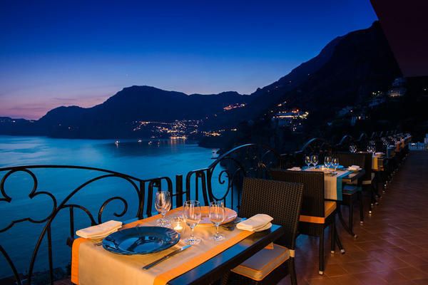 Mountain range, Table, Coastal and oceanic landforms, Furniture, Hill, Azure, Dusk, Resort town, Outdoor table, Evening, 