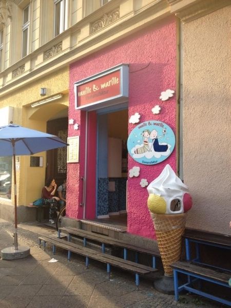 Ice cream cone, Dessert, Ice cream, Umbrella, Sidewalk, Sorbetes, Cone, Door, Dairy, Snack, 