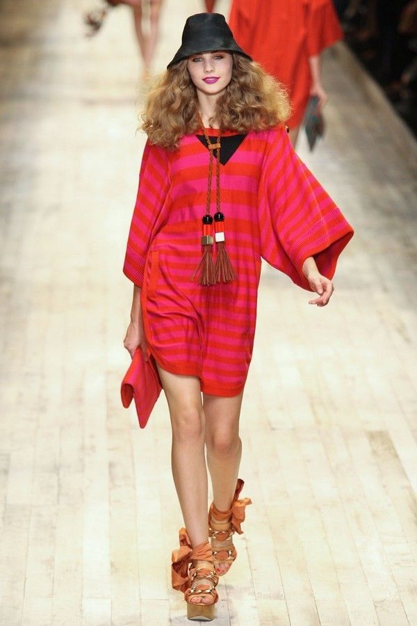 Clothing, Fashion show, Textile, Outerwear, Hat, Red, Runway, Style, Fashion model, Fashion accessory, 