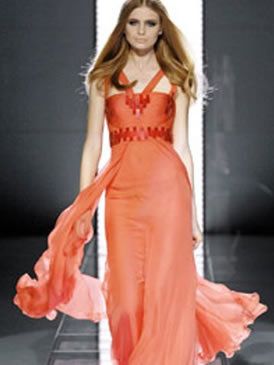 Shoulder, Dress, Joint, Red, Formal wear, Style, Orange, Fashion model, Waist, One-piece garment, 