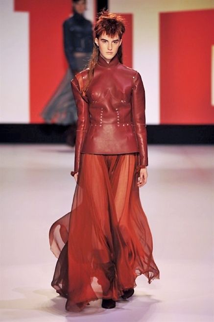 Shoulder, Textile, Joint, Red, Fashion model, Waist, Fashion show, Fashion, Costume design, Model, 