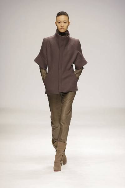 Brown, Sleeve, Human body, Fashion show, Shoulder, Joint, Outerwear, Standing, Khaki, Style, 
