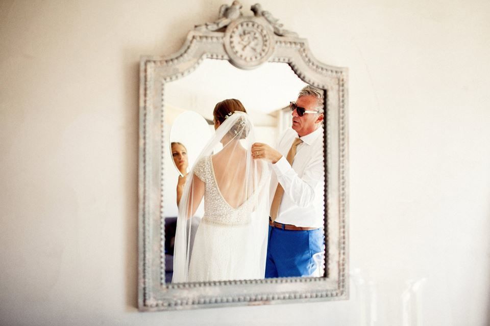 Photograph, Mirror, Bridal clothing, Bride, Embellishment, Wedding dress, Love, Gesture, Gown, Bridal accessory, 