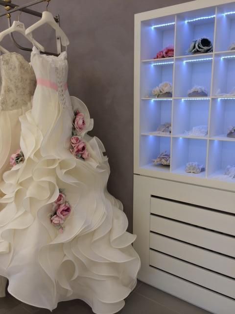 Dress, Shelf, Shelving, Gown, Wedding dress, One-piece garment, Display case, Bridal clothing, Embellishment, Ivory, 