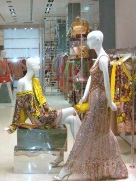 Sculpture, Temple, Mannequin, Retail, Display window, Statue, One-piece garment, Temple, Display case, Day dress, 