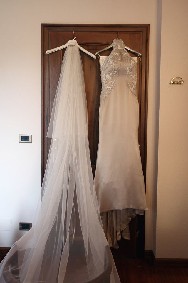 Textile, Bridal clothing, Dress, Wedding dress, Floor, Gown, Bride, Embellishment, Ivory, Bridal accessory, 