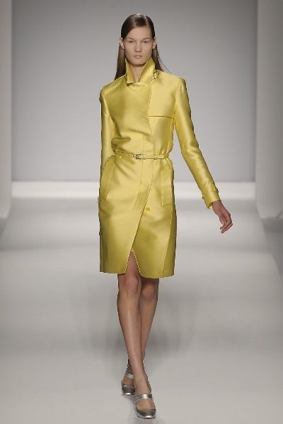 Clothing, Yellow, Sleeve, Human leg, Shoulder, Textile, Joint, Style, Formal wear, One-piece garment, 