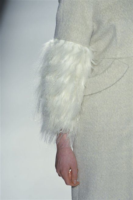 Costume accessory, Natural material, Fur, Feather, Body jewelry, Animal product, Ring, Silver, Fur clothing, 