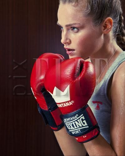Face, Nose, Boxing glove, Mouth, Boxing, Professional boxer, Boxing equipment, Sport venue, Glove, Sleeveless shirt, 