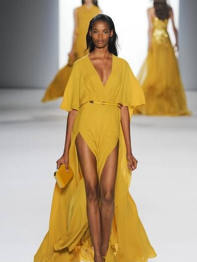 Clothing, Brown, Yellow, Hairstyle, Event, Shoulder, Fashion show, Joint, Formal wear, Runway, 